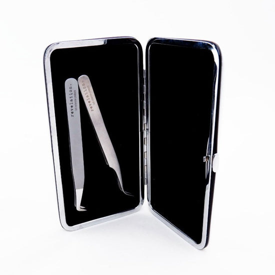 Opened Magnetic Eyelash Extension Tweezers case. This image shows the magnetic power that holds two tweezers upright.